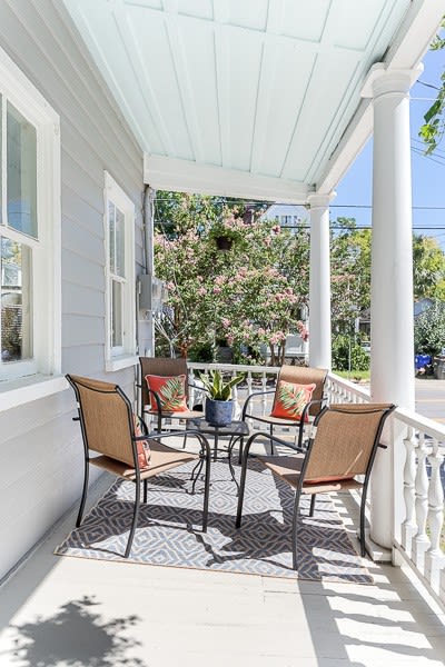 There is outdoor seating on each of the balconies. This is the first floor balcony.