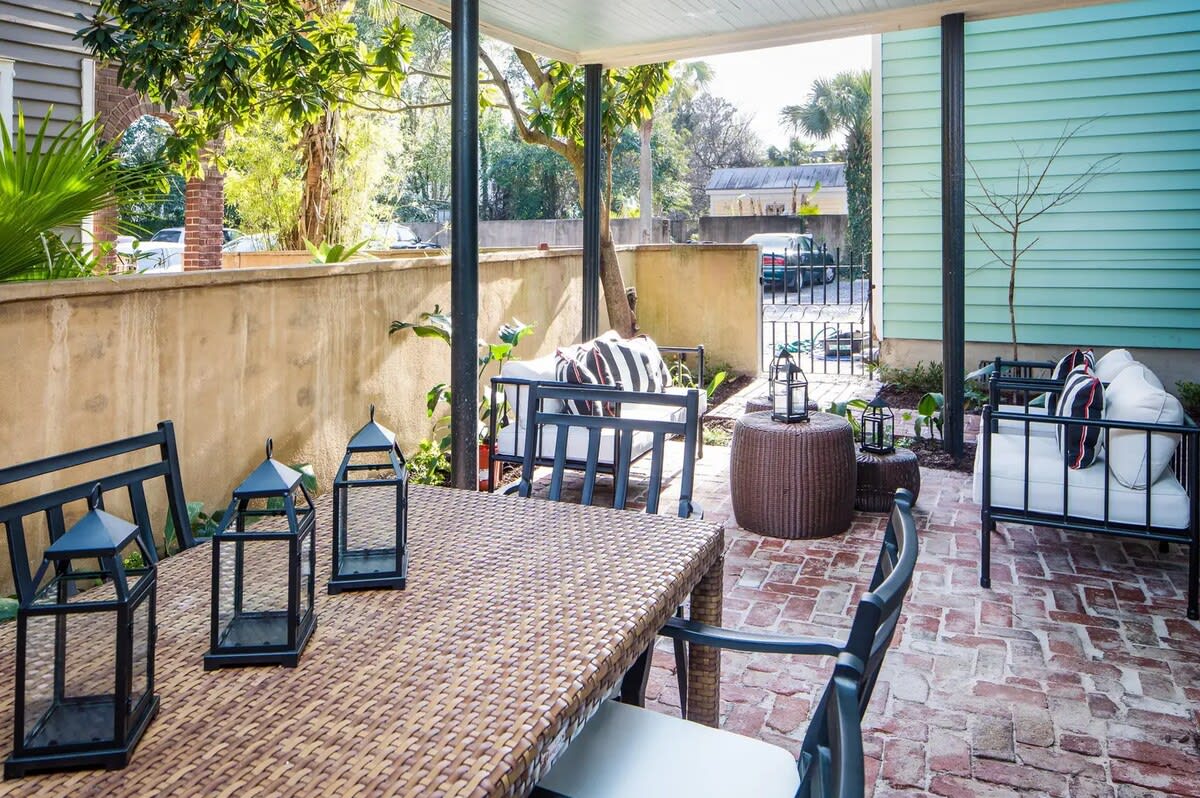 Covered back patio with table + seating