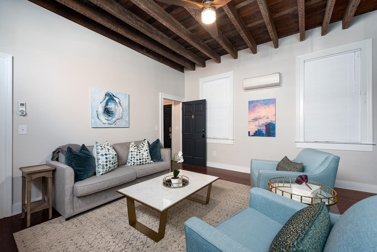 Living room with ample seating + 3 barstools