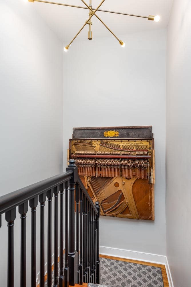 Vintage Piano in main stairwell, precious gem discovered during renovation!