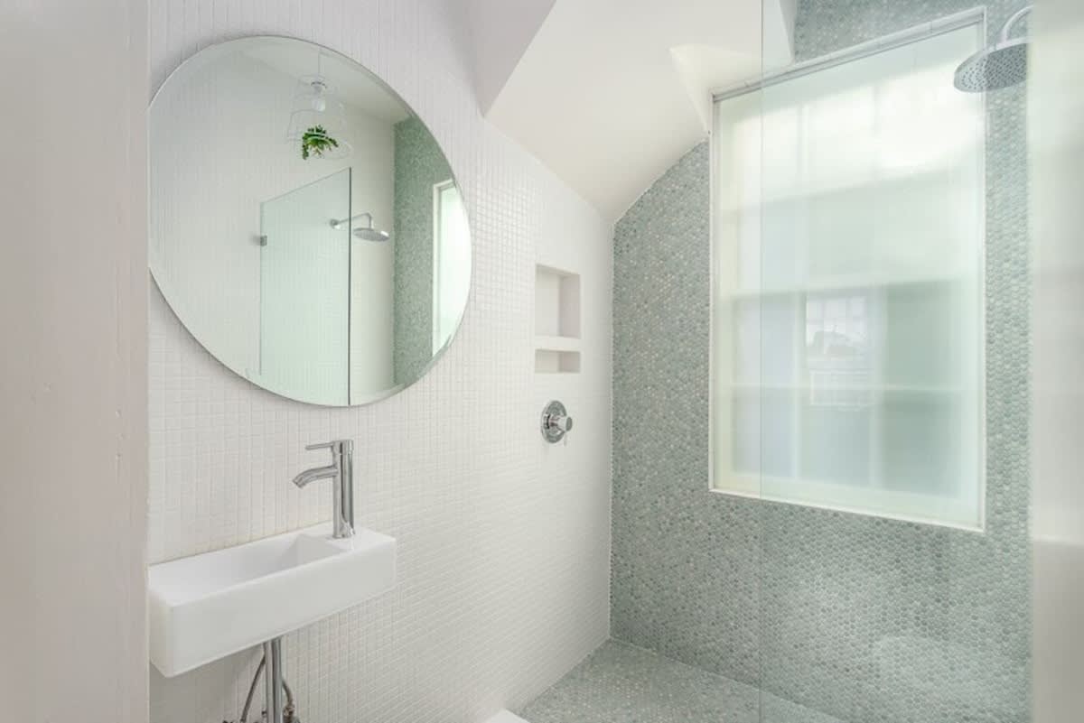 Second full bathroom with tile shower and rain head (off the living room next to pullout) 