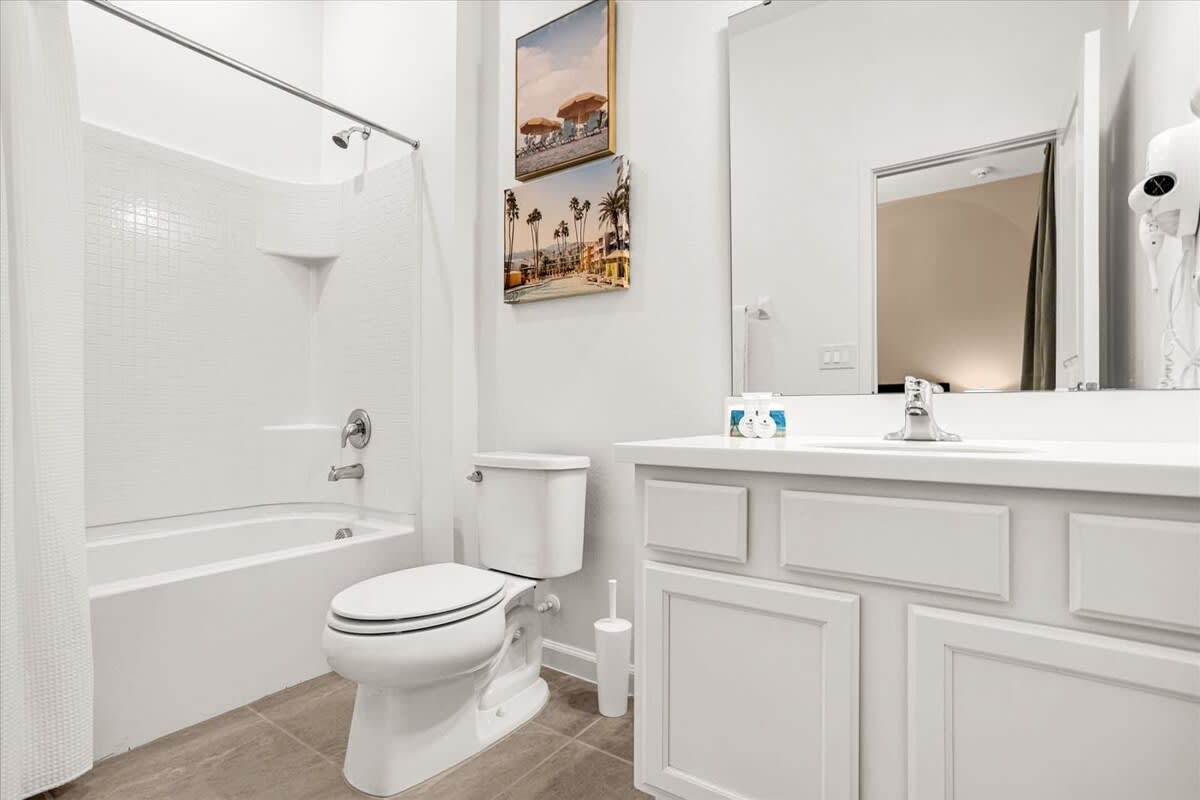 Modern Bathroom Featuring A Spacious Shower And Elegant Vanity