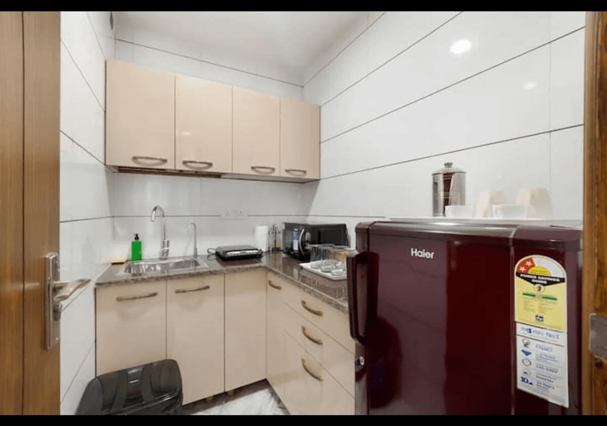 A fully-equipped kitchen featuring modern appliances, spacious countertops, and a complete range of culinary amenities