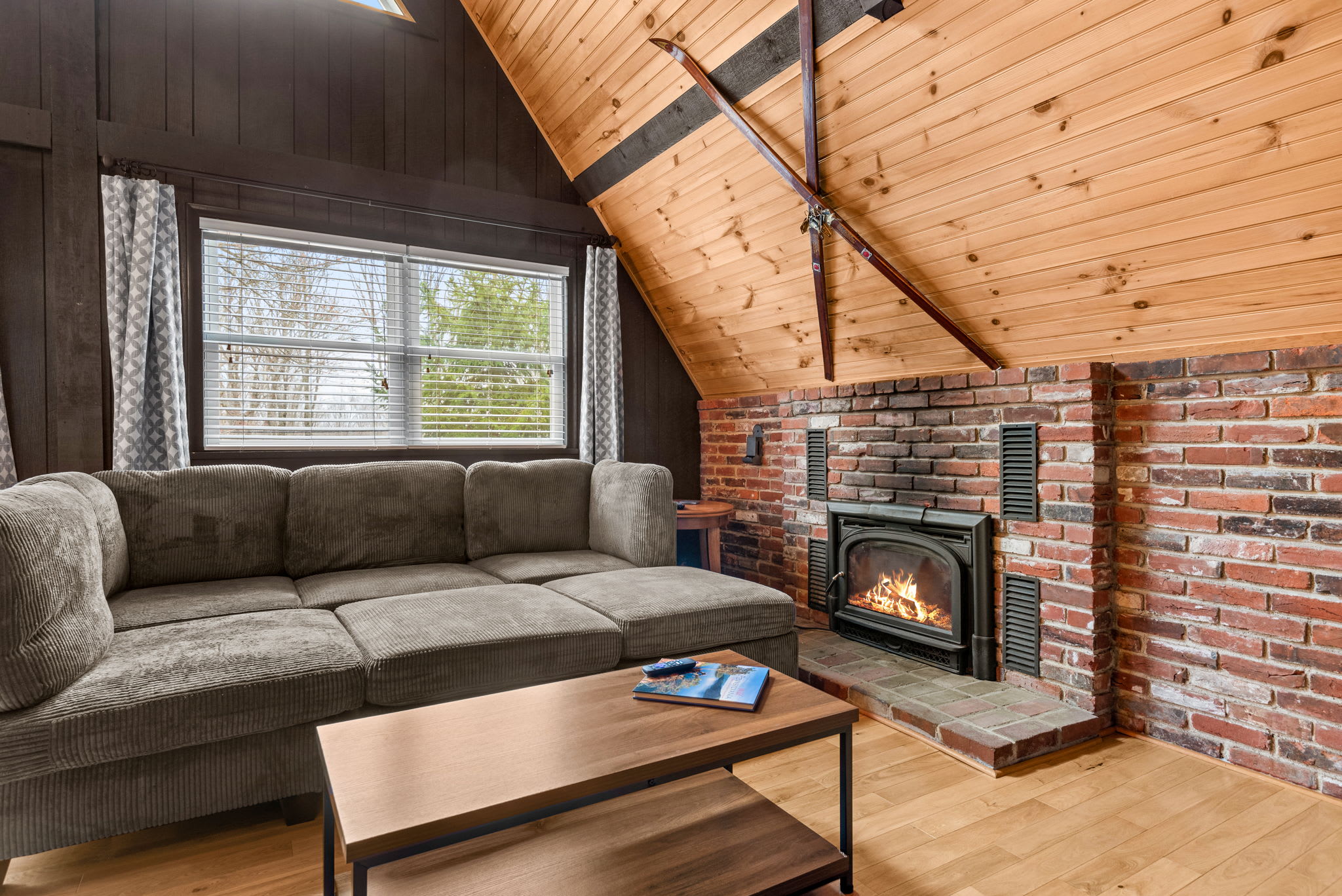 A close-up view of the rustic brick fireplace, perfect for cozy evenings in the cabin.