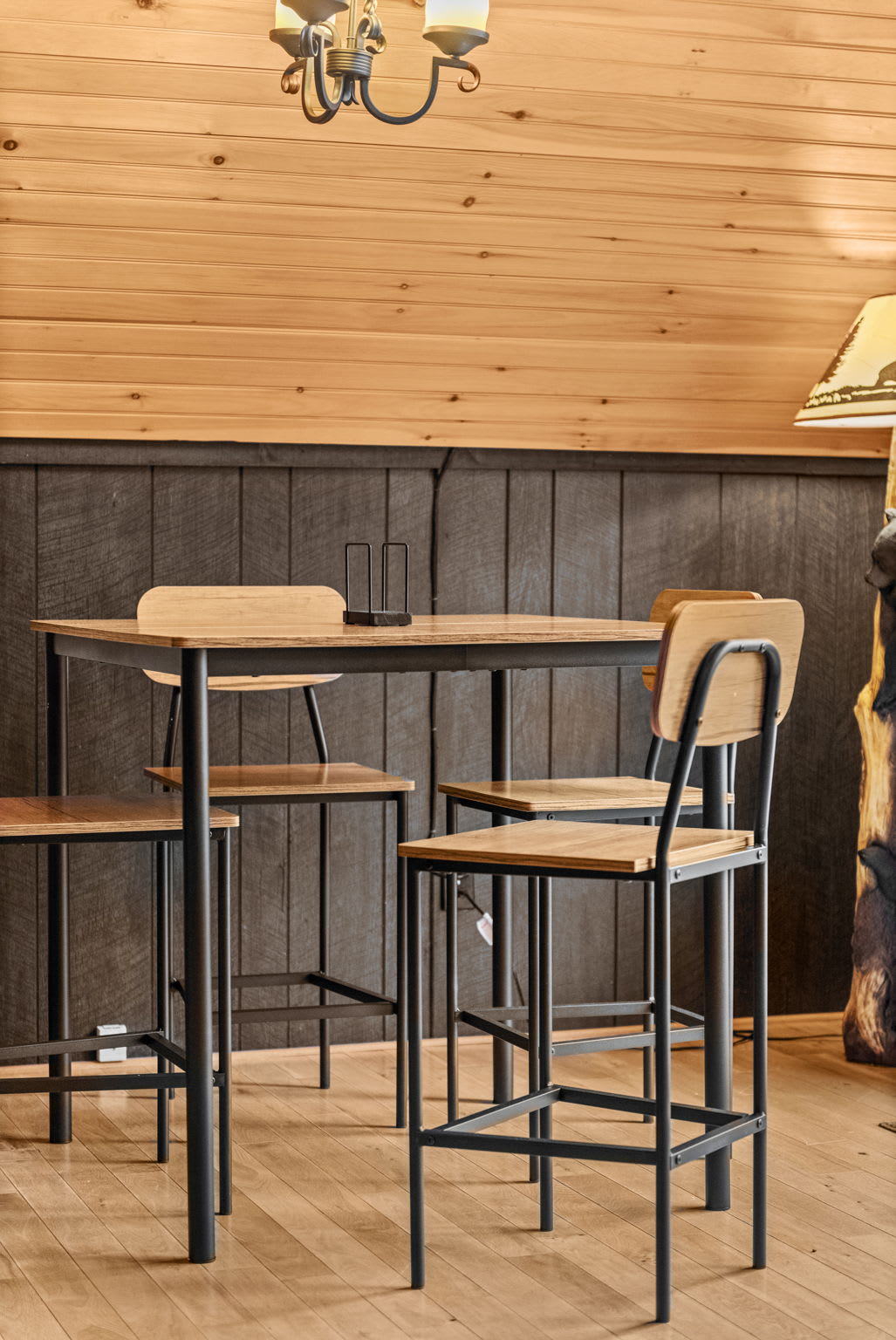 A stylish dining setup featuring a modern industrial table and chairs, perfect for intimate meals.