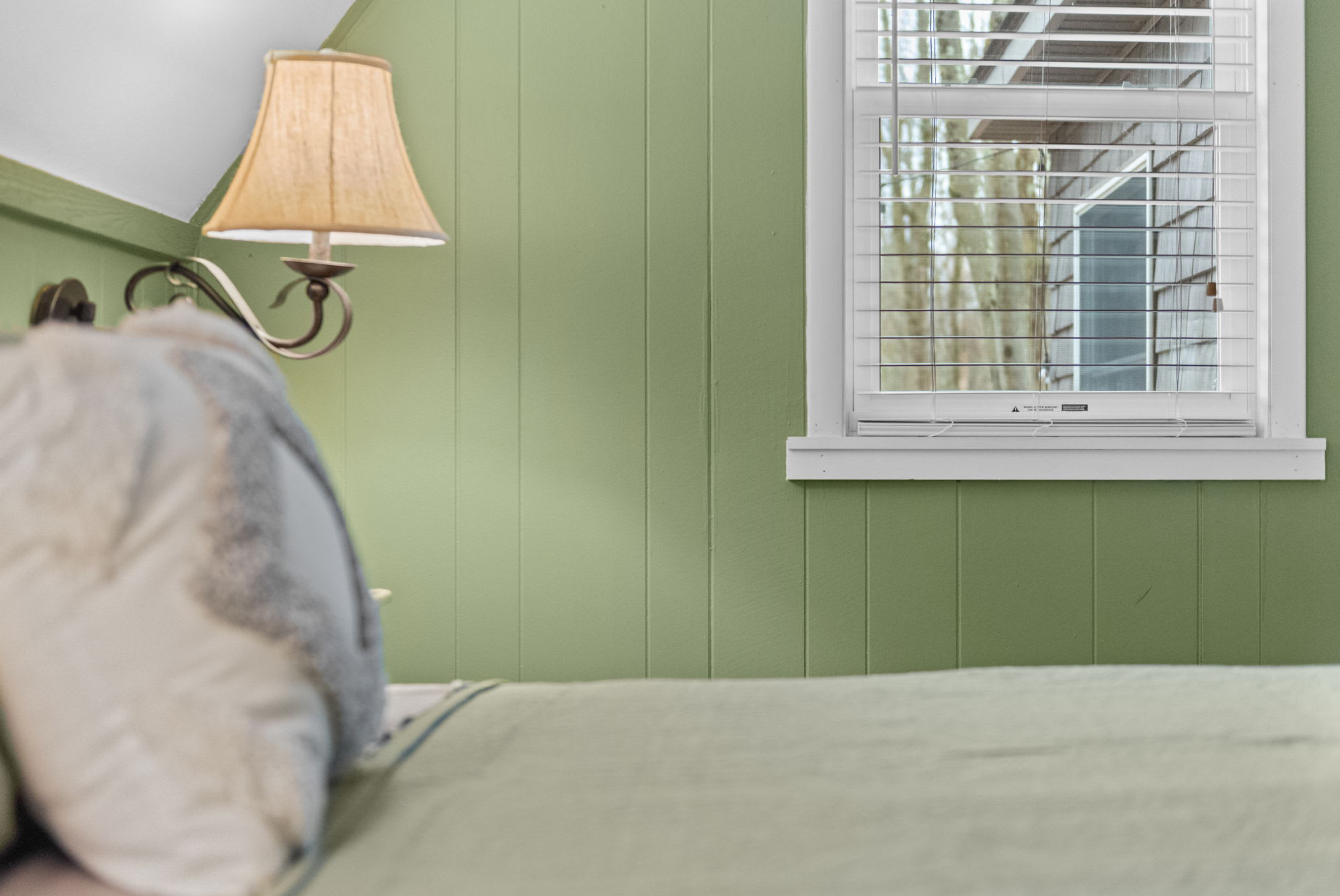 A peaceful window-side perspective showing natural light streaming in and the cozy cabin interior.