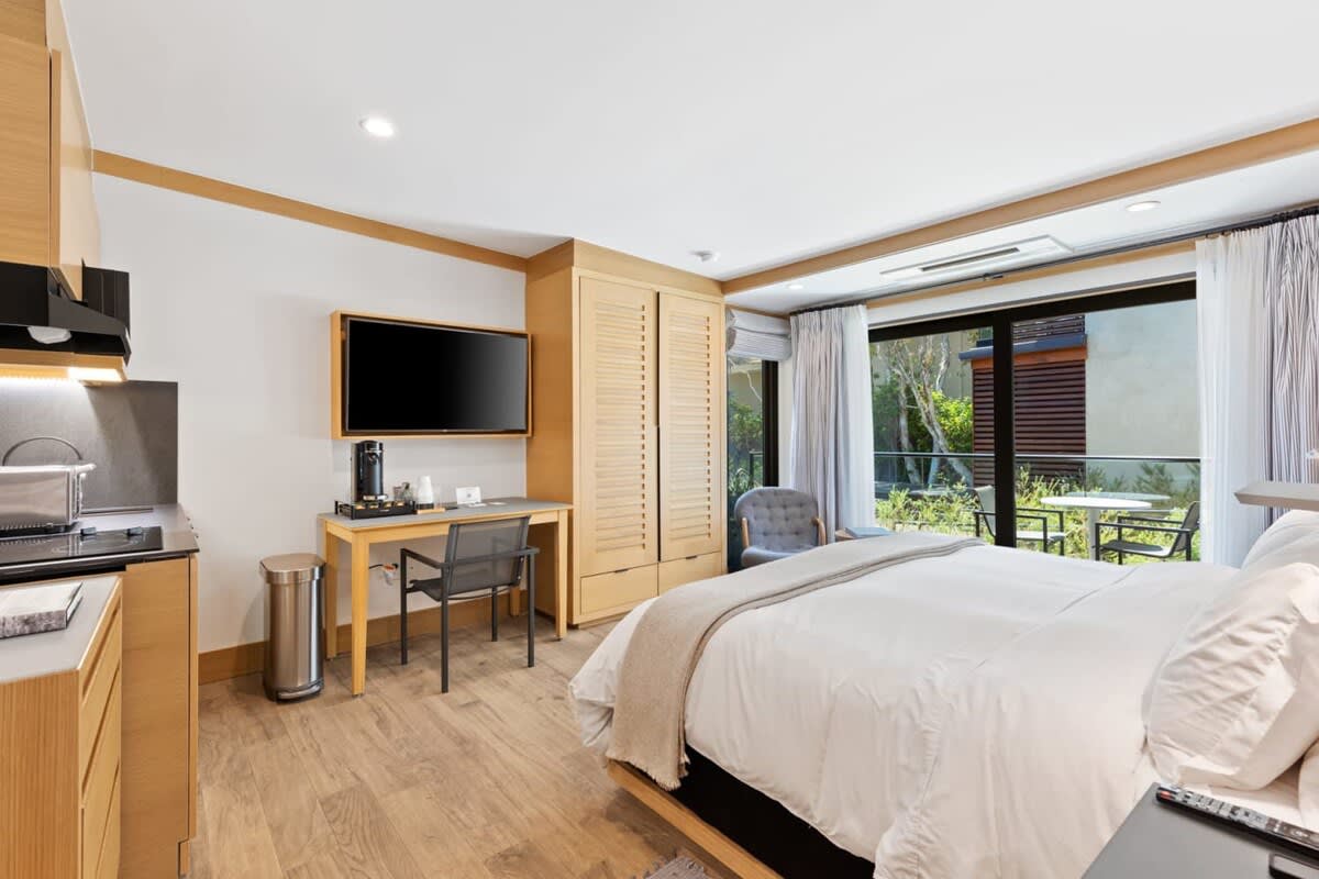 Luxurious linens line the bed.