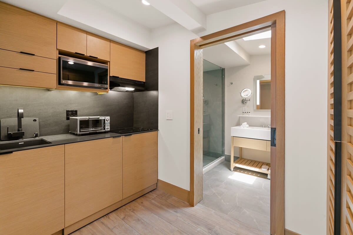 A fully stocked kitchenette with all the essentials and high-end appliances.