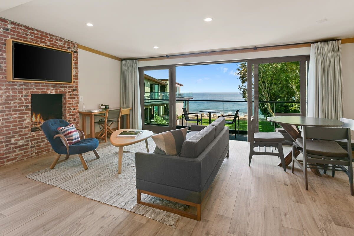 Create a warm ambiance with the crackling fireplace, overlooking the best views in Malibu, California