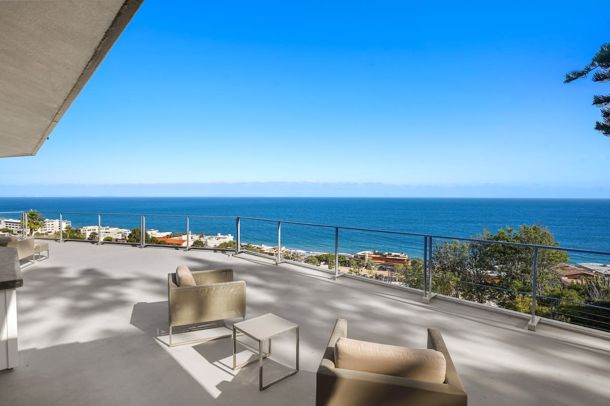 Start your day off right in the outdoor sitting area of the third bedroom, a perfect spot for enjoying a cup of coffee and soaking in the morning sun.