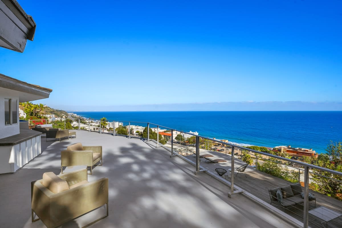 Discover a peaceful sitting area outside each bedroom on the second floor, perfect for enjoying moments of relaxation and taking in the surrounding beauty.