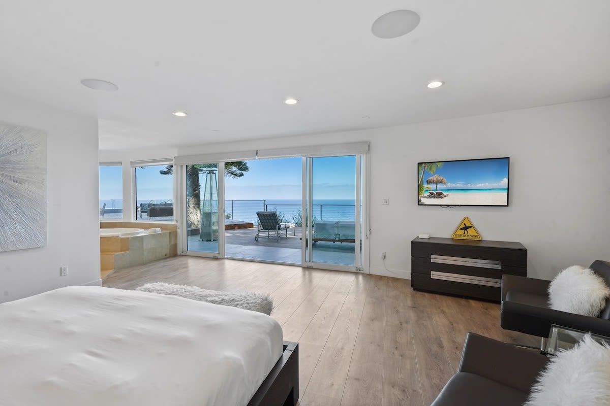 Breathtaking panoramic vistas of the Pacific Ocean from the comfort of your king-sized bed in the master bedroom.