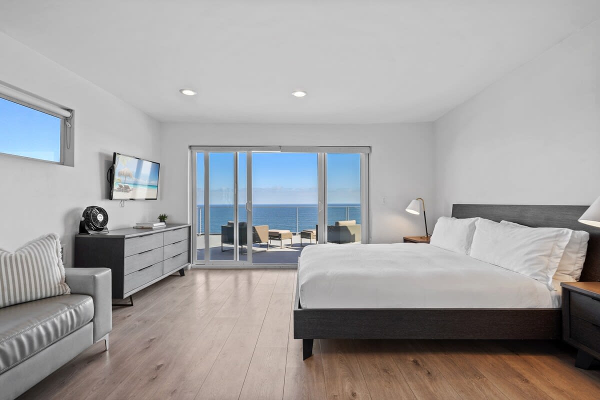Unwind in the comfort of our third bedroom's queen bed, offering a peaceful retreat.