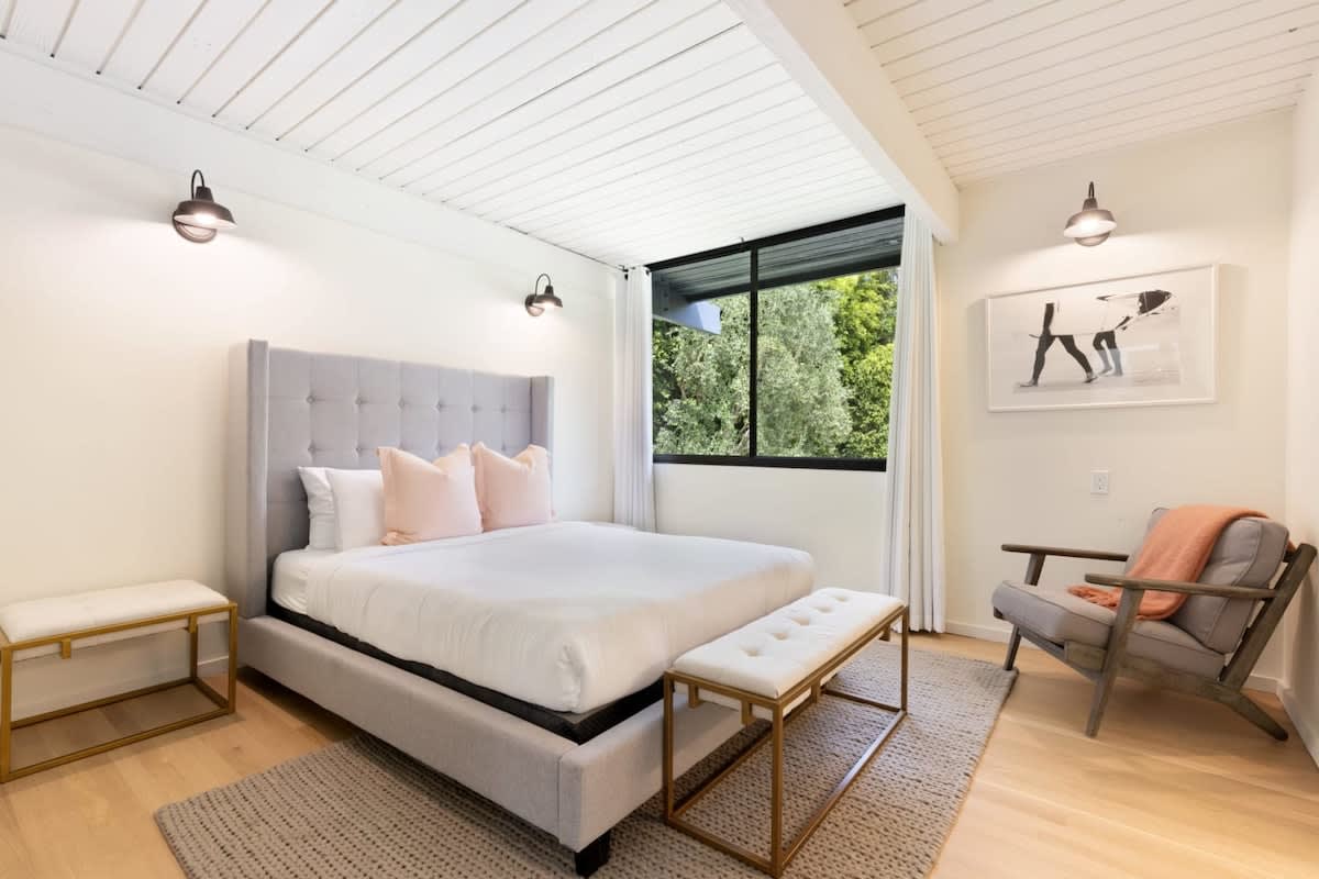 Enjoy plentiful light and an extremely comfortable bed in Guest Bedroom 1