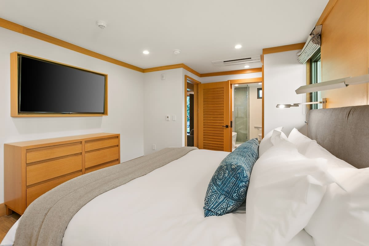 King sized bed fully outfitted with high quality linens and down comforter for a dreamy sleep
