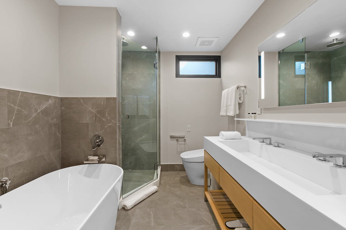 Dual sinks, and all of your everyday essentials such as Beekman toiletries, slippers and high-quality towels.