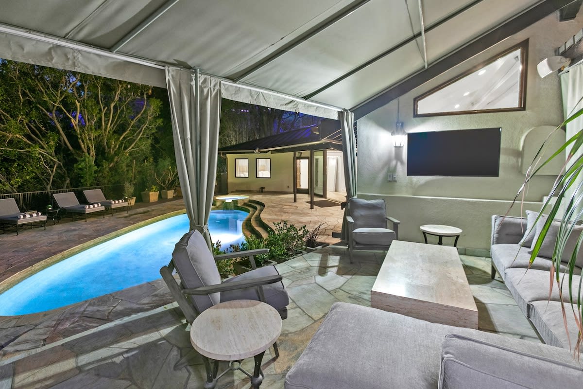 Outdoor cabana area with smart TV and outdoor speakers