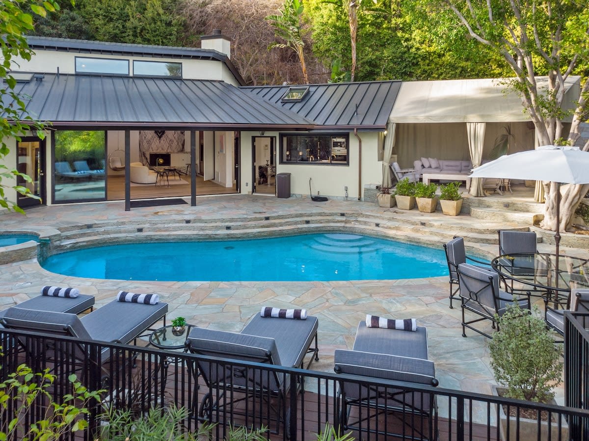 The outdoor area has built in speakers for music by the pool