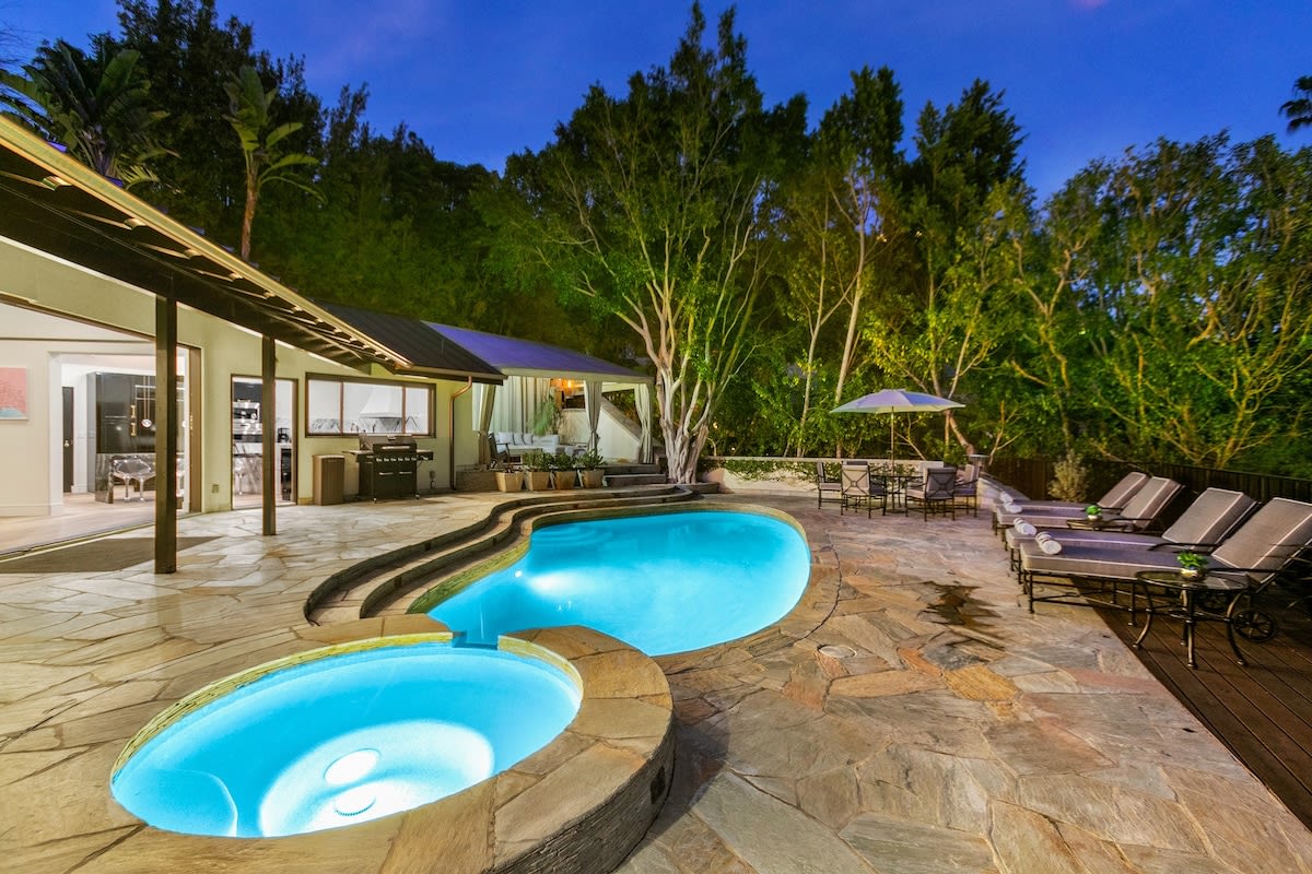 The pool and spa light up for night swimming