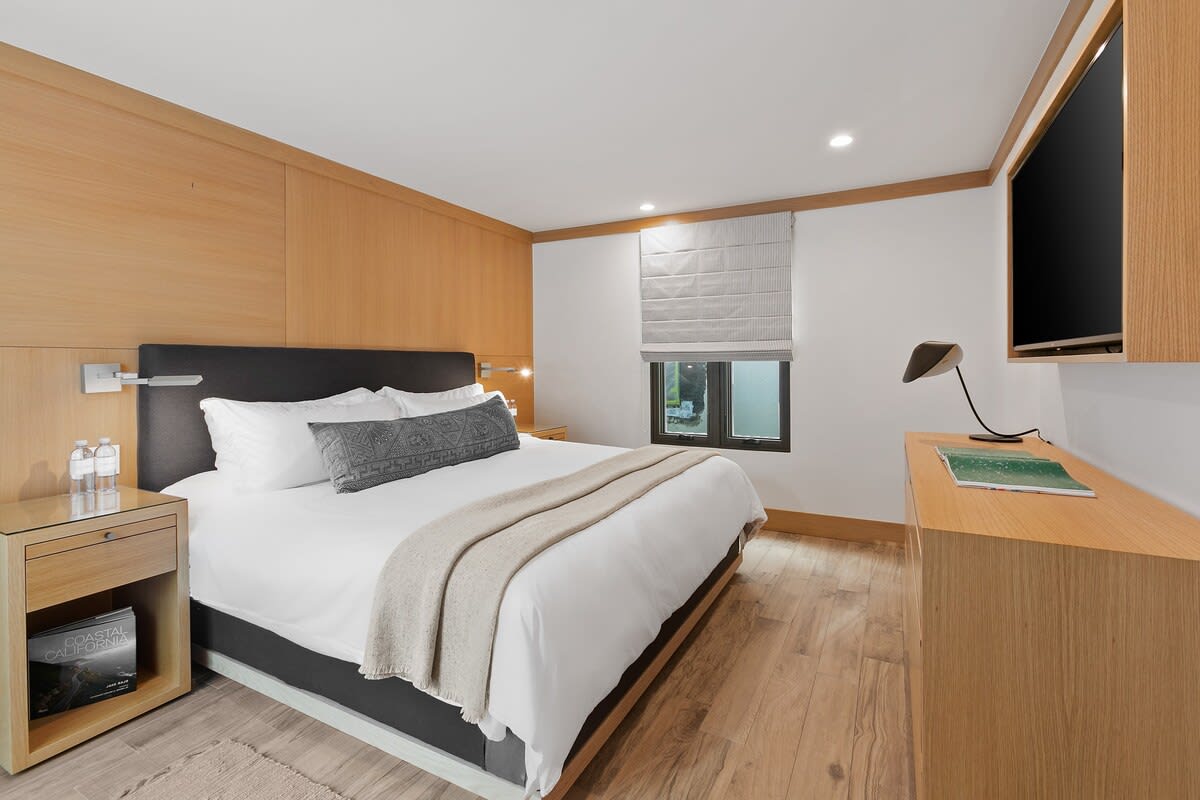 King sized bed fully outfitted with luxurious linens