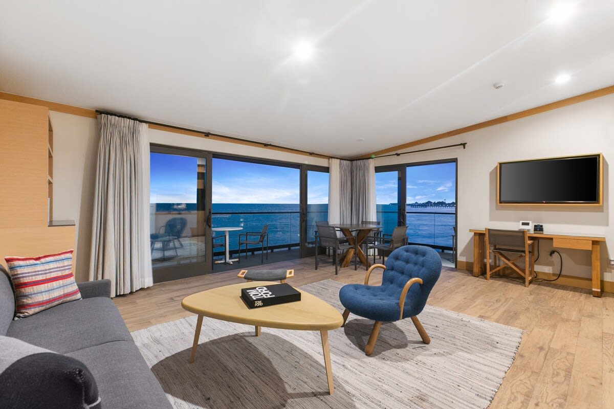 Have a glass of wine and watch the sunset from the comfort of your suite