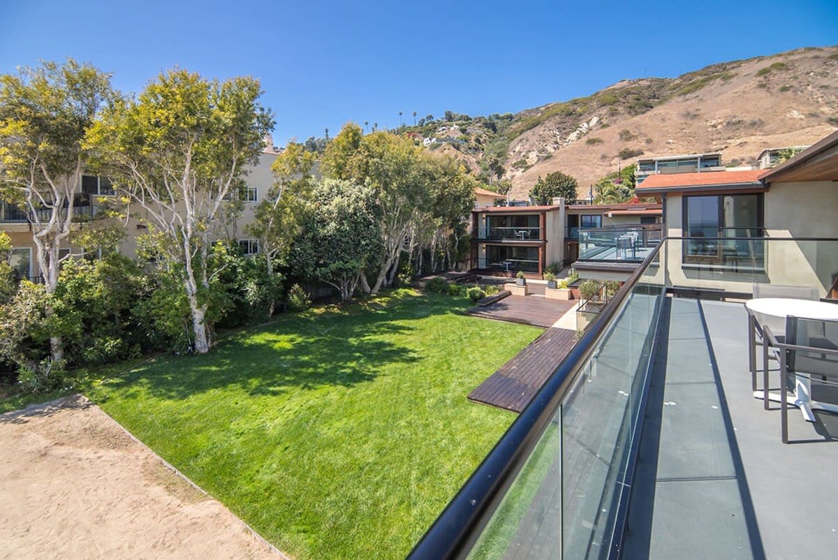 Views of the expansive grassy area from the side of the suite
