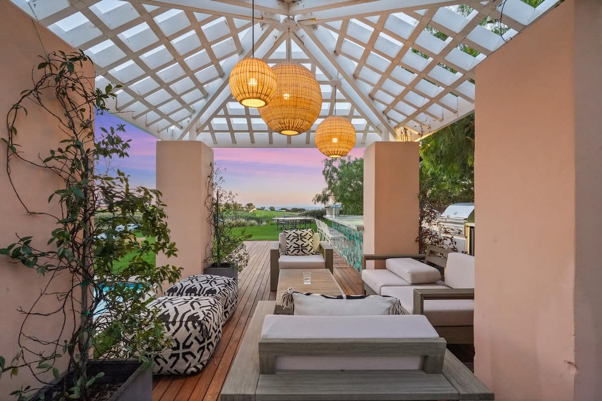 Lounge in luxury at the outdoor veranda with serene surroundings.