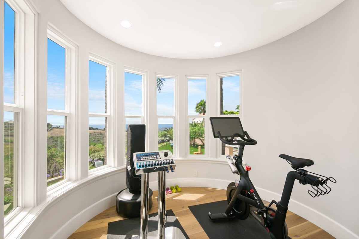 Start your morning off right in your master bedroom gym overlooking the expansive views!