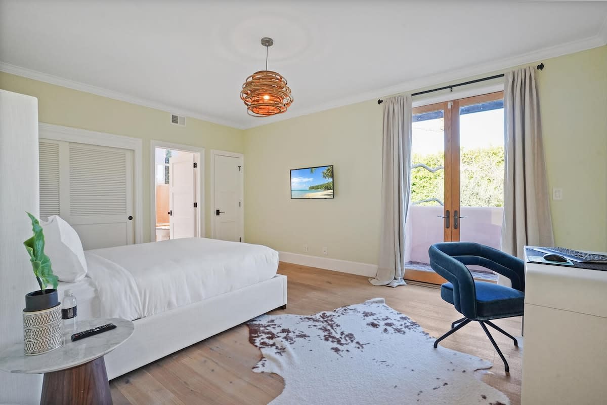 Guest bedroom equipped with modern amenities, including a TV.