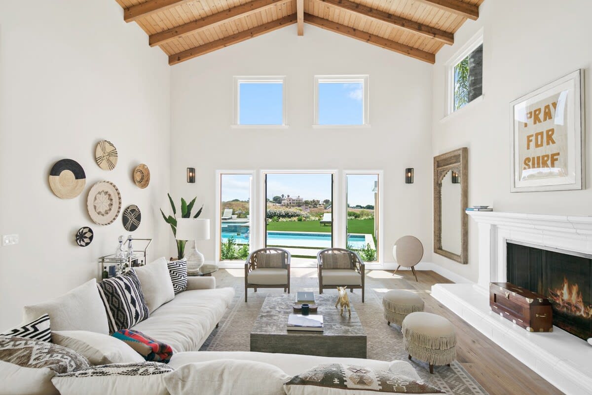 Charming decor align the walls in this bright and airy living space.