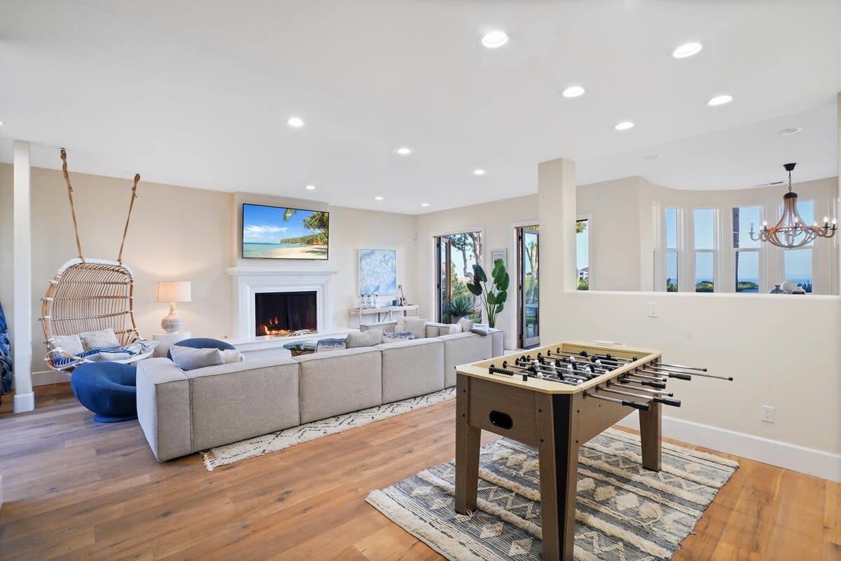 Featuring a foosball and pool table for additional entertainment.