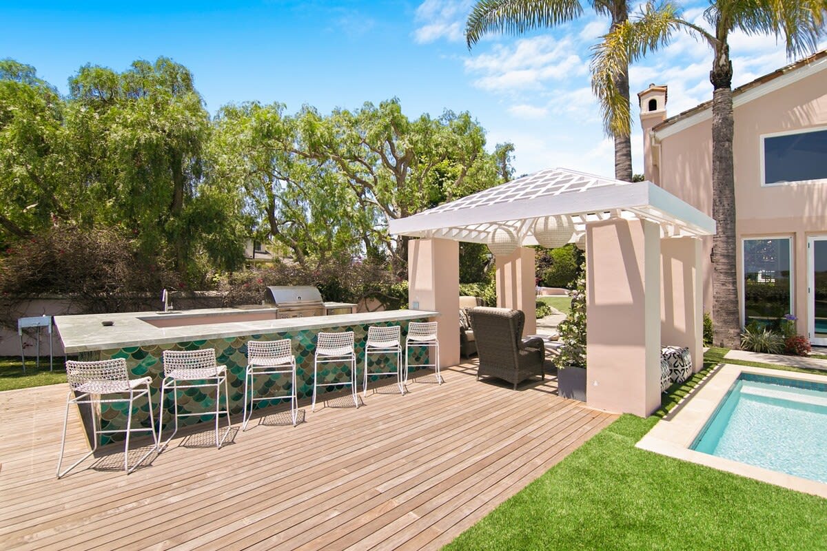 Outdoor living featuring a modern grill and plenty of room to gather and enjoy.
