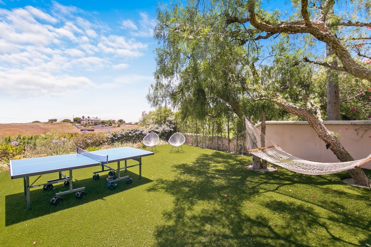 Ping pong table and hammock awaiting play and relaxation.