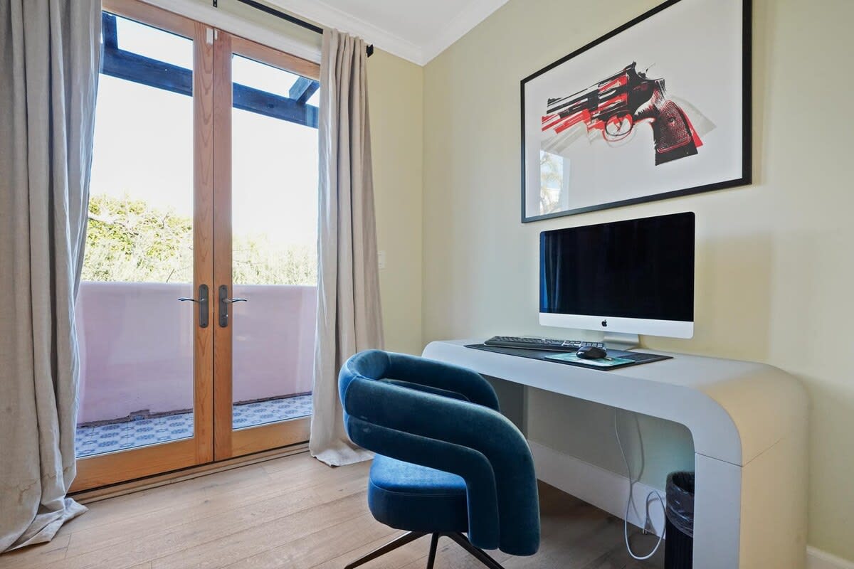 Guest bedroom with a dedicated workspace for productivity.