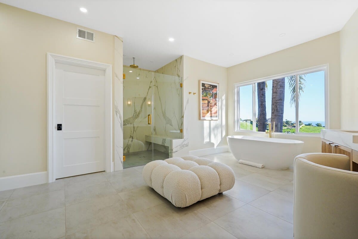 Indulge in the opulence of the master bathroom.