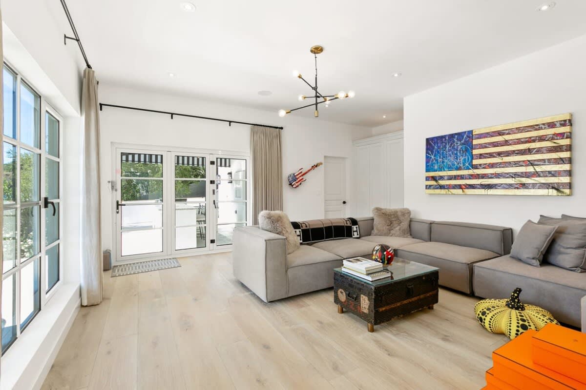 Bright natural light emphasize the high end art displayed through out this incredible property.