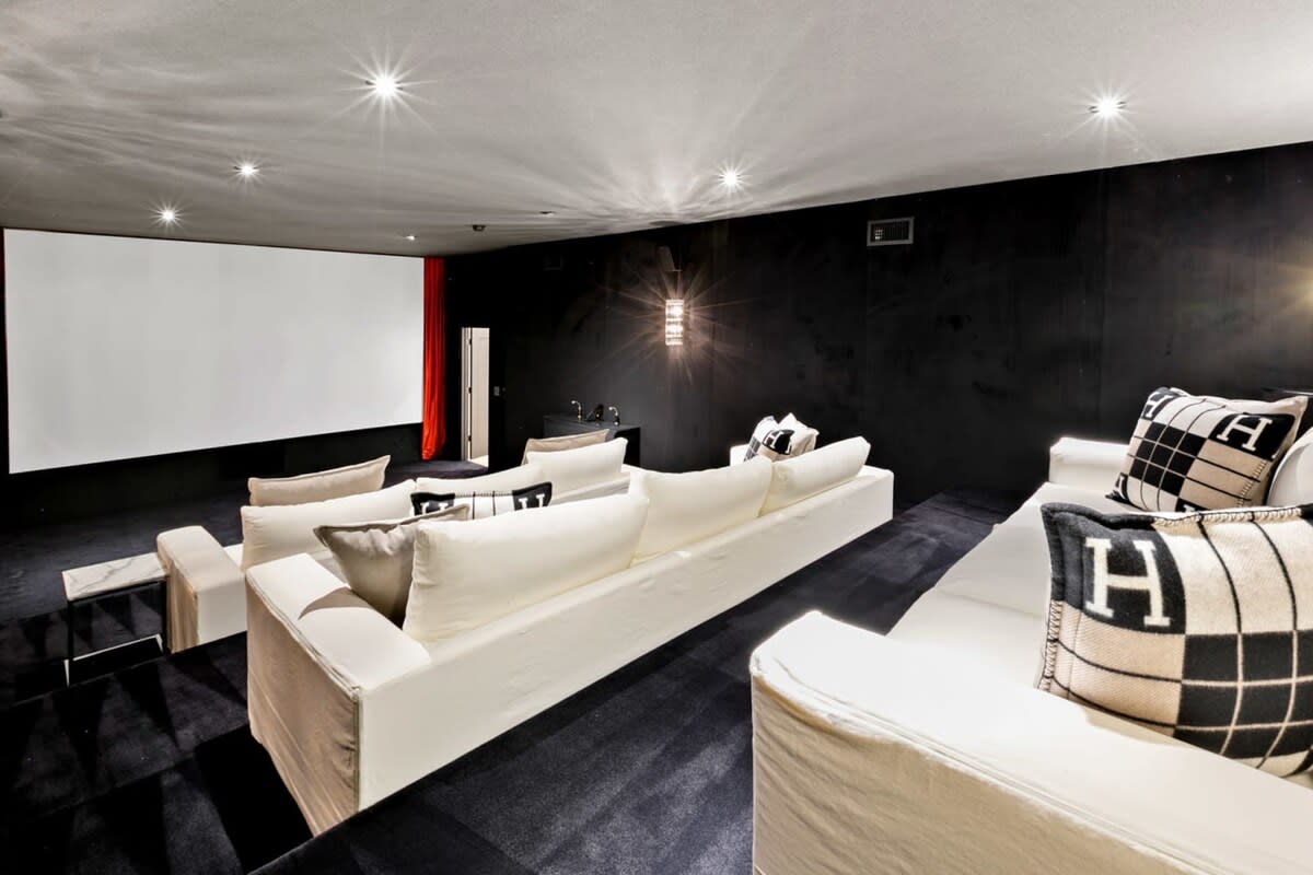 The spacious Theatre room with ample seating and pillows.