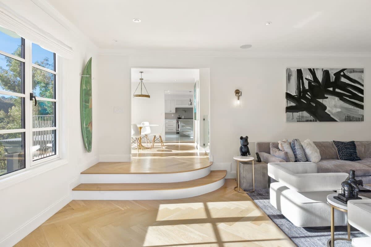 Gorgeous hardwood flooring and art work create an inspired getaway.