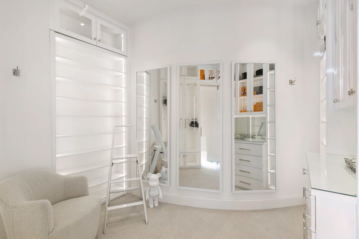 Modern walk-in closet with a flare of artwork
