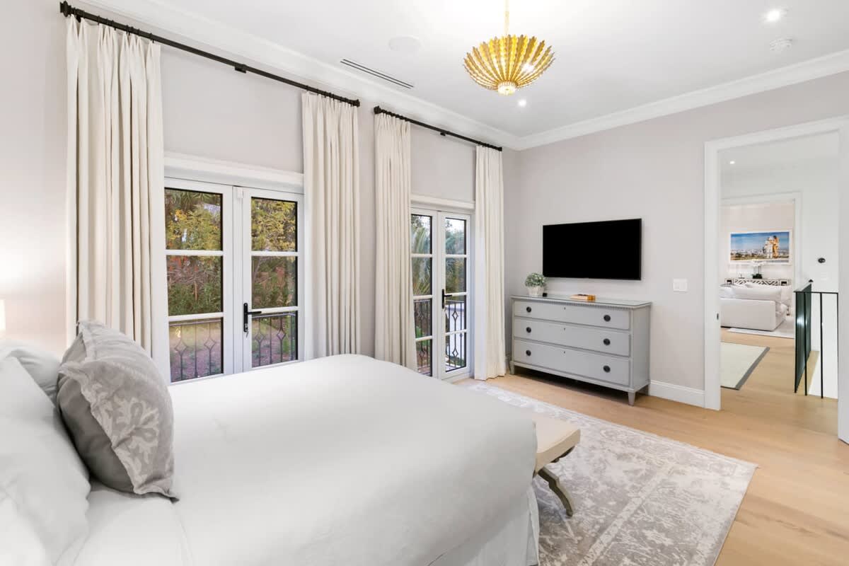 Guest bedroom with balcony for scenic views