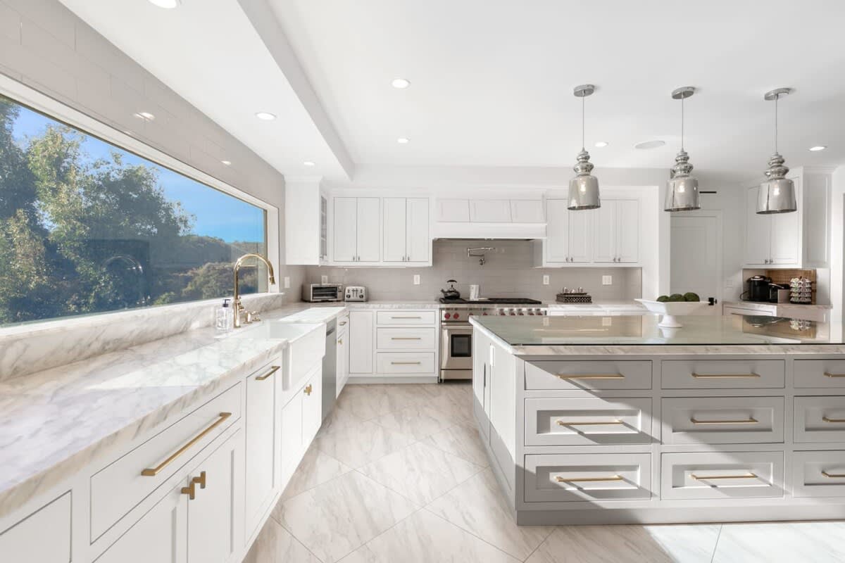 State of the art modern kitchen featuring Wolf appliances.
