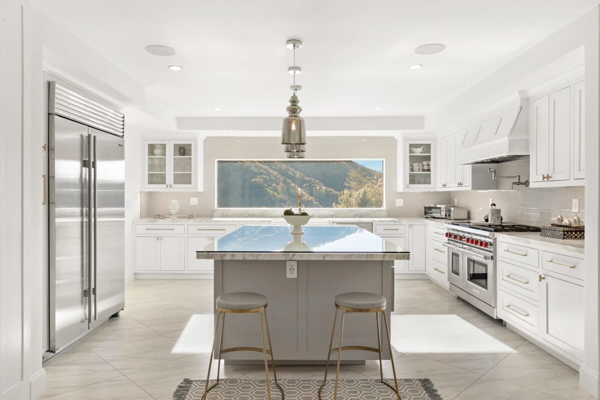 Pull up a seat of this one of a kind kitchen with panoramic views of Beverly Hills.
