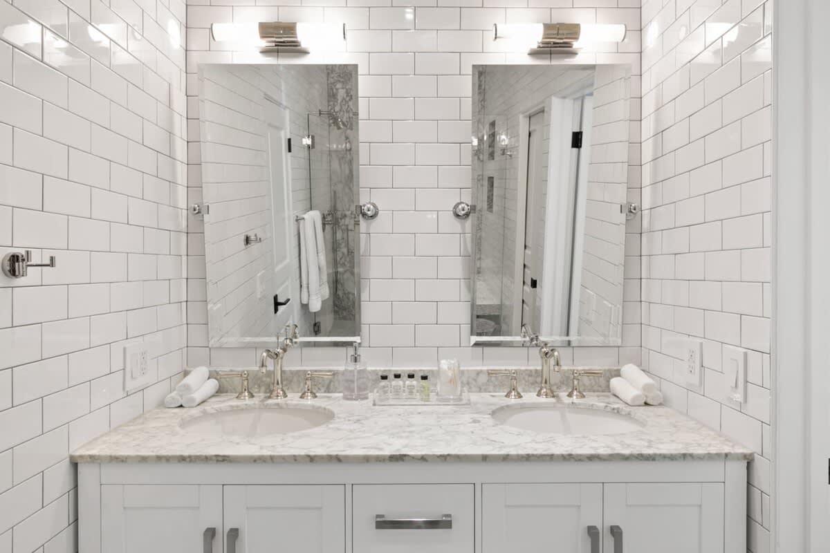 Dual mirrored His and Her sinks for extra comfort.