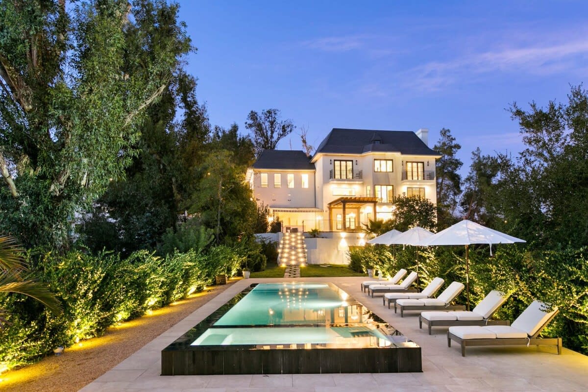 Take a nighttime swim in this incredible zero edge pool.