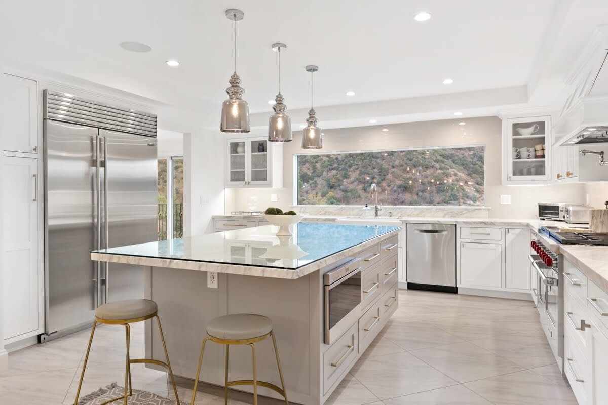 These classic lines of the kitchen area are perfectly suited for a panoramic view of this hillside in Los Angeles.