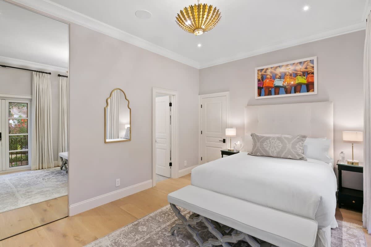 Exquisite bedroom with clean lines and superb artwork!