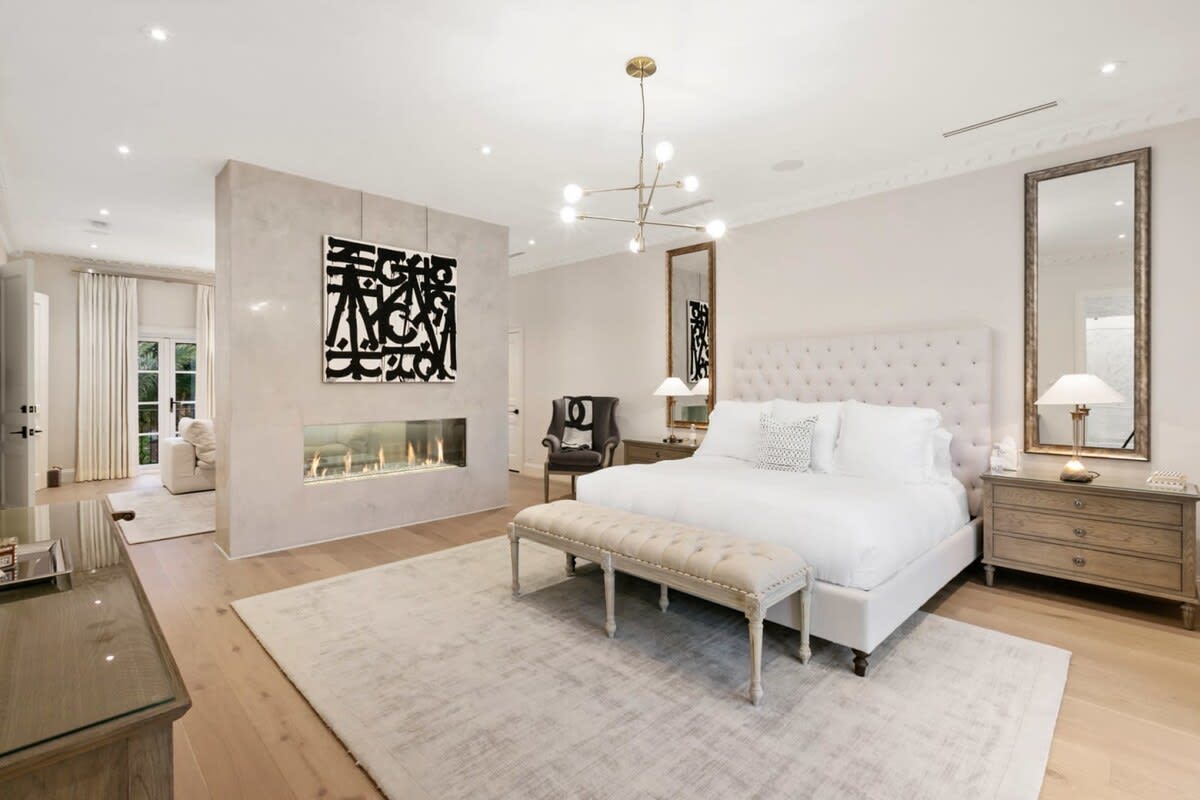 Master bedroom with King size bed, dual sided fire place for ultimate enjoyment.