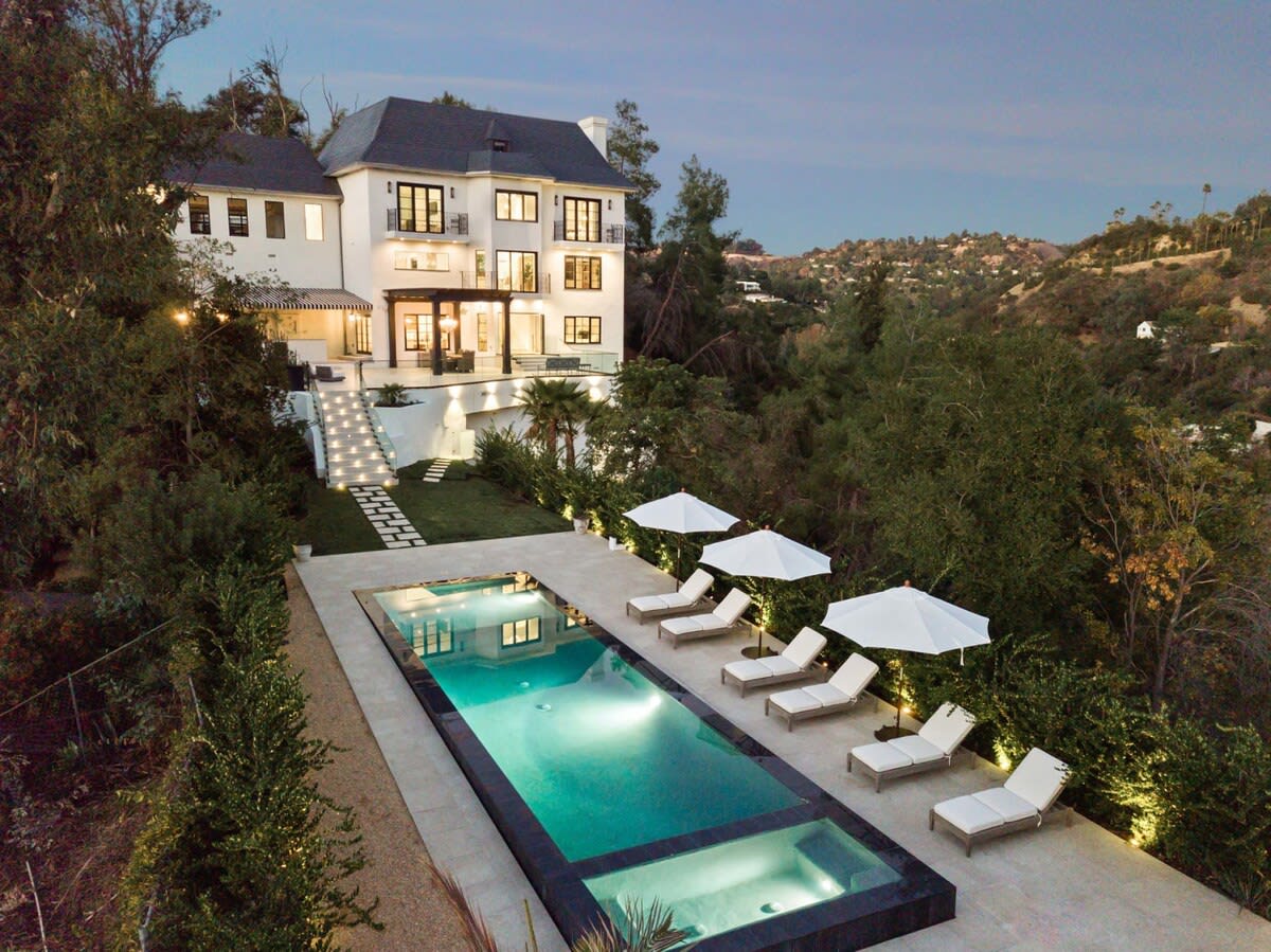 Outdoor lighting emphasize this property's classical beauty.