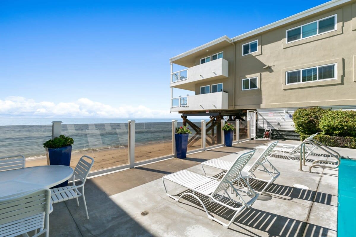 Lounger chairs facing the Pacific Ocean.