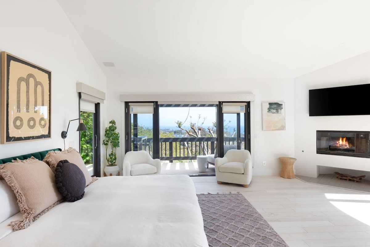 Master bedroom overlooking the backyard oasis and Pacific Ocean Views.
